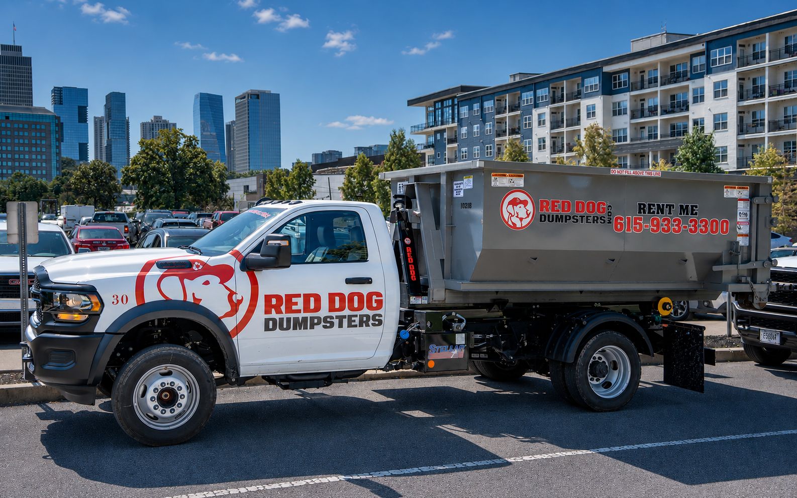 Red Dog Dumpsters truck parked with the Nashville skyline in the background